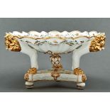 A Derby fluted comport, c1825, painted with the rose barbeaux pattern, on three gilt lion monopodia,