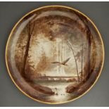 A Copeland wall plaque, 1879, painted by William Yale, signed, with a heron in a wood, the rim gilt,