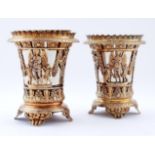 A pair of Italian silver gilt openwork vases, in Empire style and of beaker form, decorated with