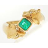 An emerald and diamond 'big cats' ring, the step cut emerald approximately 4.5 x 4.5mm, the cats