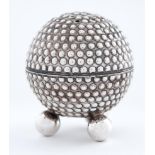 A George V silver golf ball novelty pepperette, on three ball feet, 50mm h, by Walker & Hall,