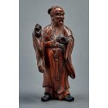 A Chinese carved wood figure of Shou-Lao, 19th / 20th c, 17.5cm h Dusty / dirty, lacking the whisk