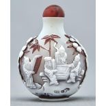 A Chinese triple overlay cameo glass snuff bottle, 20th c, in opal glass overlaid in mushroom