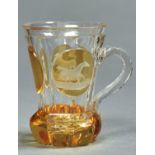 A Bohemian amber flashed glass mug, c1860, engraved to either side with a horse, 13cm h Good