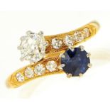 A sapphire and diamond crossover ring, early 20th c, the old cut diamond of approximately 0.25ct,