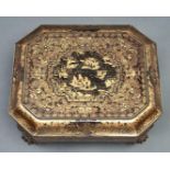A Chinese black and gold lacquer games box, mid 19th c, richly decorated with scenes framed by