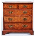 A walnut and burr walnut chest of drawers, late 20th c, in George II style, with pierced brass