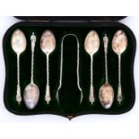 A set of six Edwardian silver teaspoons and pair of sugar bows, Apostle pattern, by William