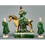 A Chinese Sancai glazed tileworks equestrian figure ridge tile and two green glazed moulded and