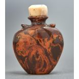 A Chinese amber snuff bottle, 20th c, with vestigial shoulder handles, 50mm h, bone stopper Good