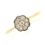 A diamond cluster ring in gold marked 18ct, 2.8g, size R½ Light wear