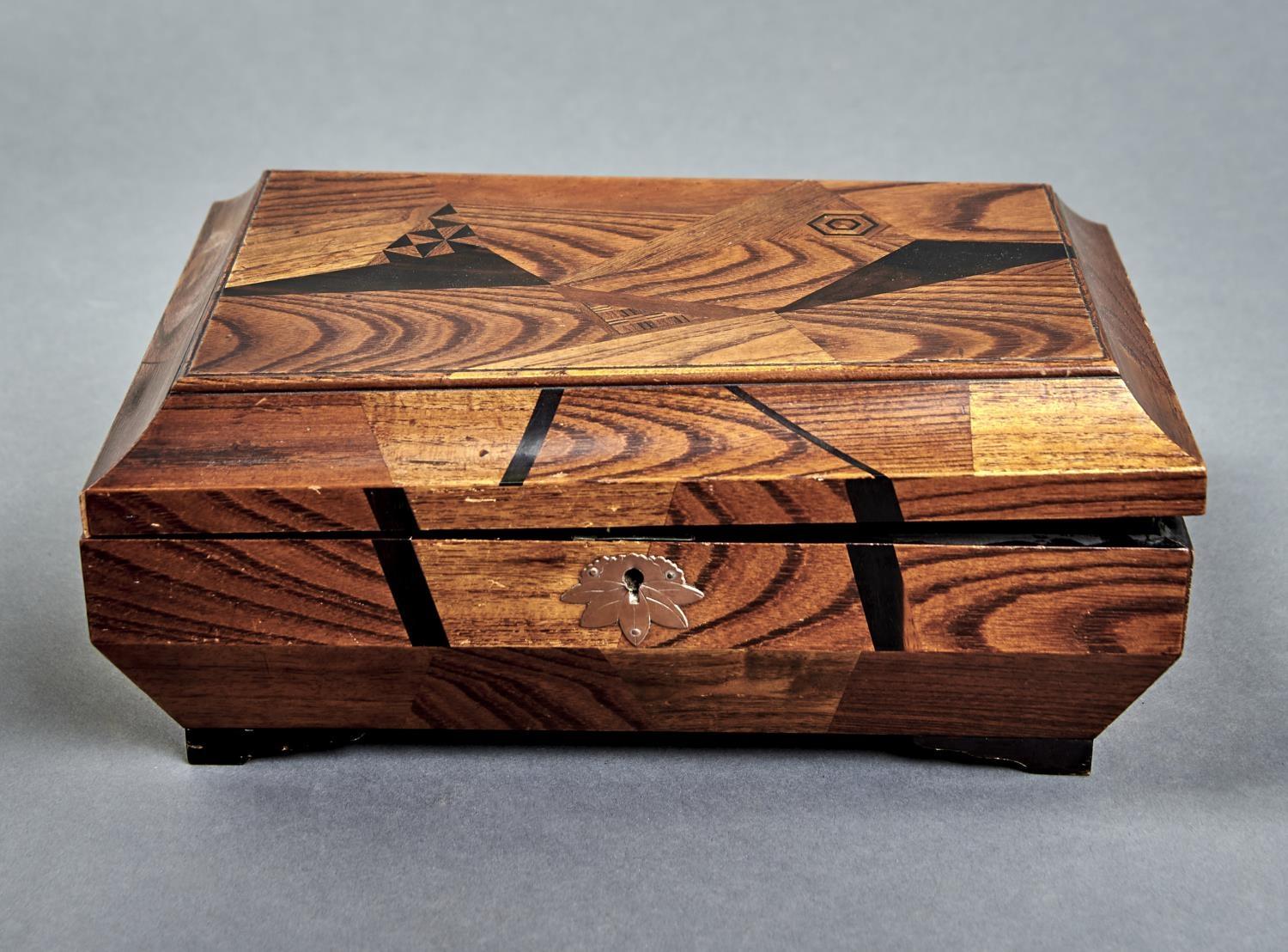 A Japanese elm and parquetry box of shallow sarcophagus form, c1900, the hinged lid parquetry