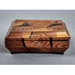 A Japanese elm and parquetry box of shallow sarcophagus form, c1900, the hinged lid parquetry