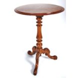 A Victorian walnut tripod table, the round, figured top inlaid with flowers on turned pillar and