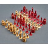 A Victorian red stained bone chess set,  kings 10cm h, another similar, king 10cm h, missing two