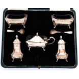 A George VI five piece silver condiment set, blue glass liners, pepperettes 8cm h, by Barker Bros