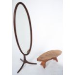 An adjustable oval mahogany cheval mirror on tripod, late 20th c, 163cm h and an oak coffee table (