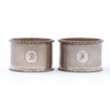 A pair of George VI silver napkin rings, engine turned, by Crisford & Norris limited, Birmingham