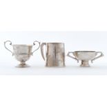 A George VI silver mug, 88mm h, by Crisford & Norris Limited, Birmingham 1939 and two silver
