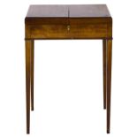 A George III mahogany dressing table, c1800, the top hinged at the sides revealing an interior