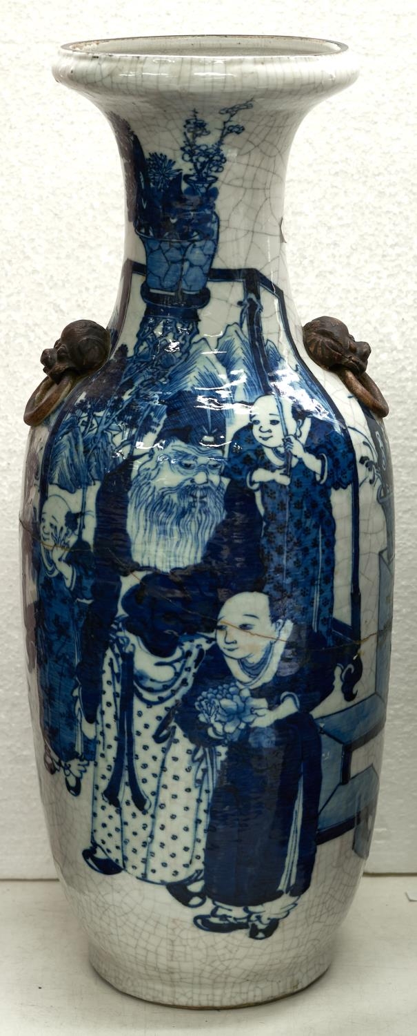 A Chinese blue and white crackle glazed vase, late 19th c, with mask handles, 60cm h Broken and re-