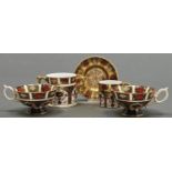 A Royal Crown Derby Imari pattern loving cup, coffee can and saucer and pair of teacups, late 20th