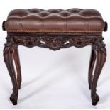 A George III style carved wood piano stool, covered in brown button back leather, 53cm h; 56 x 35cm