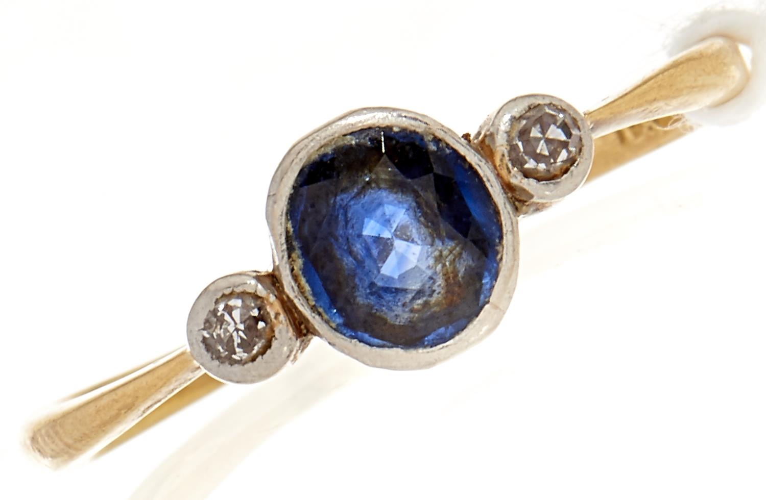 A diamond and sapphire ring, in gold marked 18, 1.8g, Size N