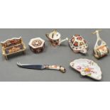 Five Royal Crown Derby Imari pattern miniature objects, including a tortoise paperweight and two