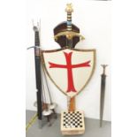 A games compendium mounted with a reproduction sword and shield, 128cm h, four fencing swords and