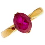 A 22ct gold wedding ring, adapted and set with a synthetic ruby, Birmingham 1932, 5g, size M