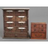 A softwood spice chest,  fitted seven drawers, three with enamel labels, early 20th c, 28cm h and