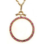 A ruby, split pearl and gold locket, marked 9ct and a gold necklet marked 9c, 8g excluding glass