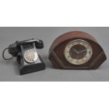 A T E L black Bakelite table telephone,  the underside marked JL 11560 A6 and an oak mantel clock
