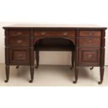 A George IV mahogany dressing table, c1830, fitted with drawers around a kneehole and flanked by