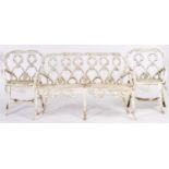 A suite of white painted cast alloy garden furniture, comprising curved back love seat and two