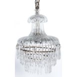 A moulded glass chandelier, second quarter 20th c,  hung with fringed tiers of beads and pendants,