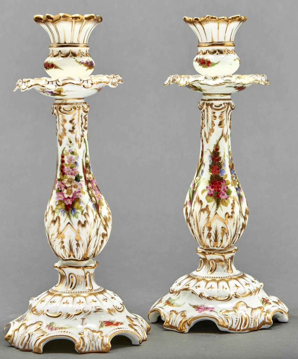 A rare pair of Coalport candlesticks, c1875, painted with flowers and gilt, 25.5cm h, printed