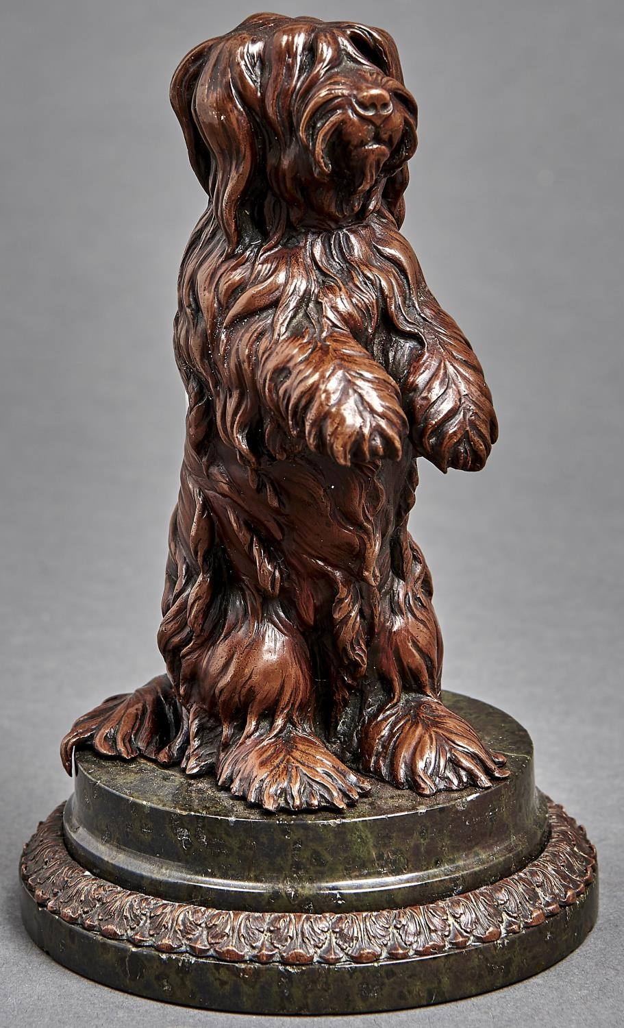 A bronzed metal sculpture of a begging dog, early 20th c,  on turned serpentine base, 17cm h Good