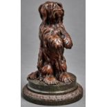 A bronzed metal sculpture of a begging dog, early 20th c,  on turned serpentine base, 17cm h Good