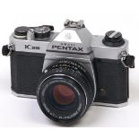 A Pentax K1000 SLR camera, with SMC Pentax-M 50mm F2 lens In apparently working order, good