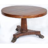 An early Victorian rosewood breakfast table, on tapered octagonal pillar, platform and carved paw