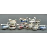 A study collection of nine English porcelain cream jugs, early 19th c, various moulded oblong and