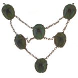 An Egyptian scarab beetle necklet, c1920, in silver coloured metal