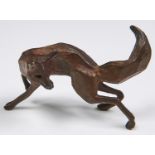 A miniature bronze sculpture of a fox,  11.5cm l, indistinctly signed in the maquette Good