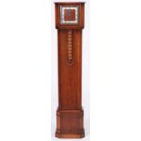 An Art Deco oak dwarf longcase clock, c1930, the English movement chiming on rod gongs, pendulum,