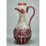 A ruby flashed and white enamelled gilt glass claret jug and stopper, c1860, 29cm h Typical handling