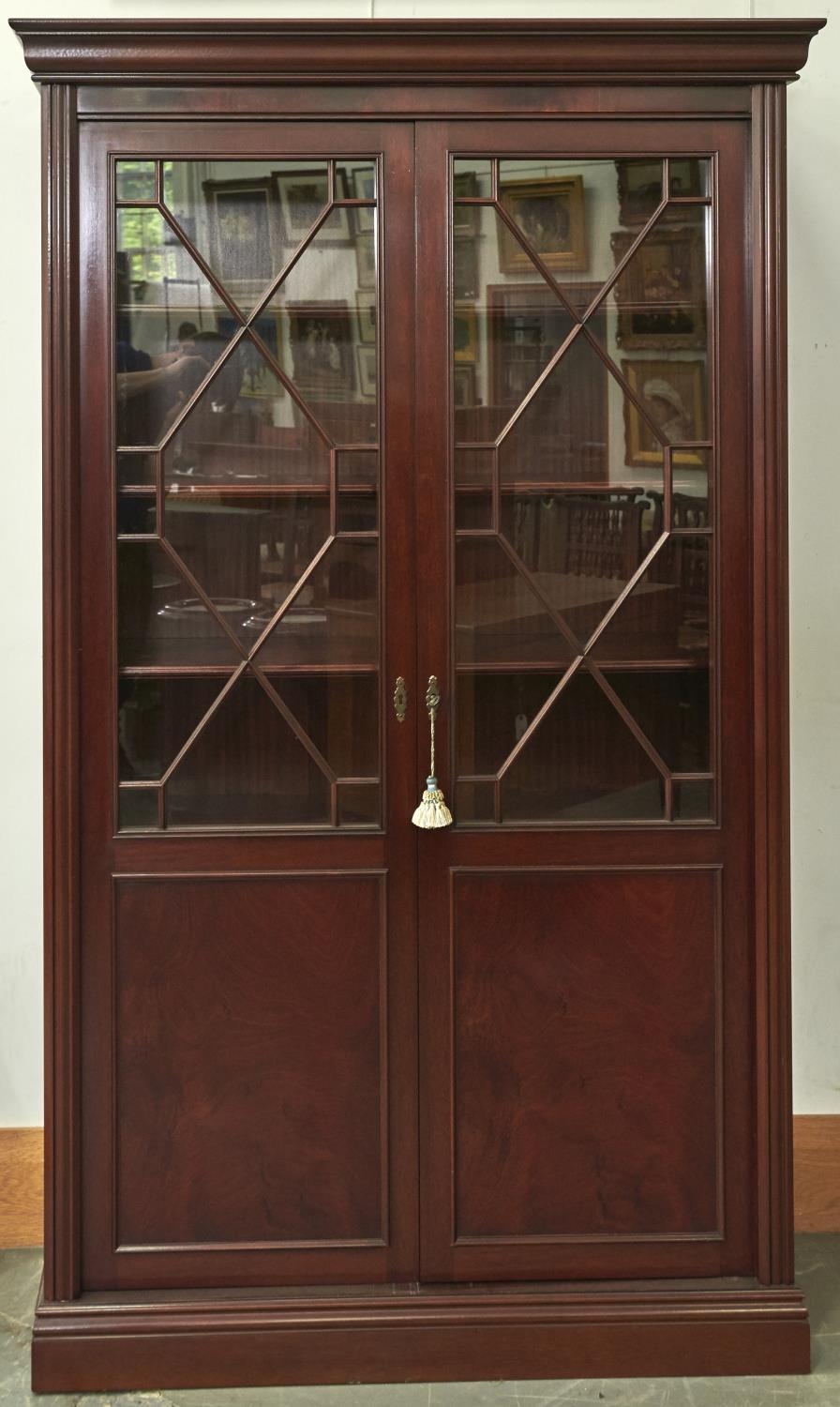 A reproduction mahogany display cabinet in George III style, modern, the ogee moulded cornice