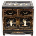 A Chinese lacquer cabinet, 20th c, the top, sides and doors applied with carved and polychrome