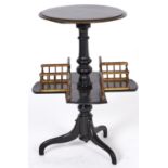 A Victorian ebonised revolving book table, c1870, with painted drab detail to the top and gallery,